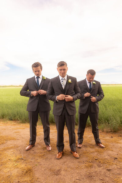 Groom and his groomsmen posing during a Utah wedding, photographed by Lamblight Photography