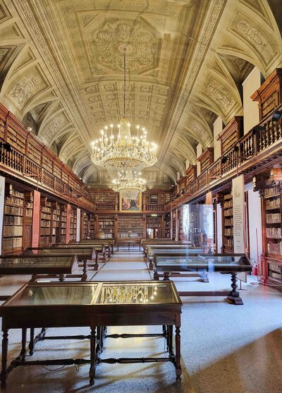 A long, ornate library in Milan, Italy