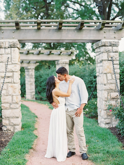 Bride and Groom kiss outside their french garden venue