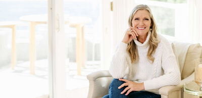 Phillipa Leseberg, author, smiling with long blonde hair in a yellow dress.