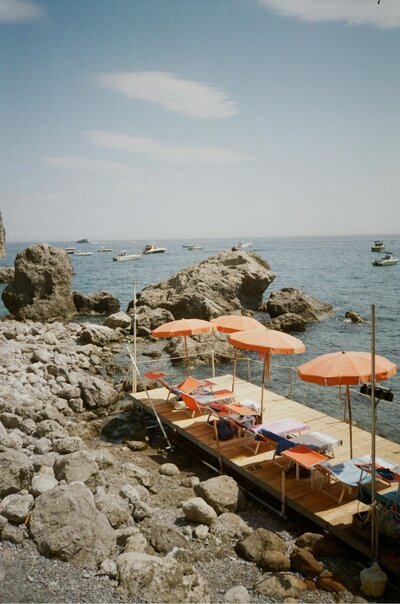 Italian Coast with tables and umbrellas