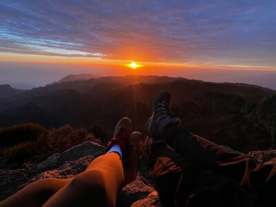 hiker sitting on edge