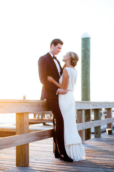 Photography of bride and groom on Bald Head Island beach after wedding.