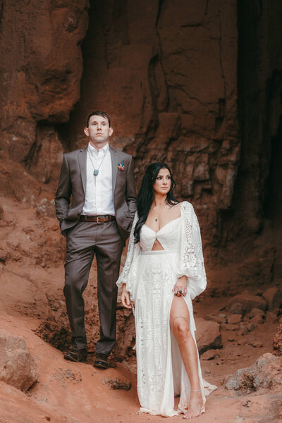 Couple standing in Big Cave in Palo Duro