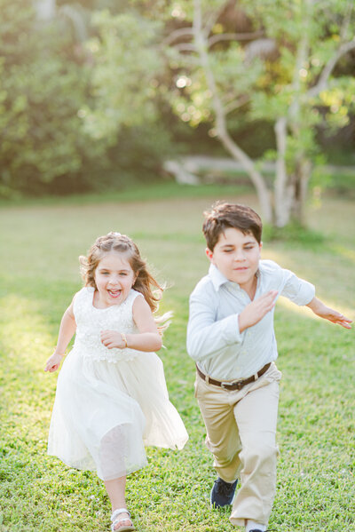 siblings holding hands in the park family session by Miami lifestyle photographers David and Meivys of MSP Photography