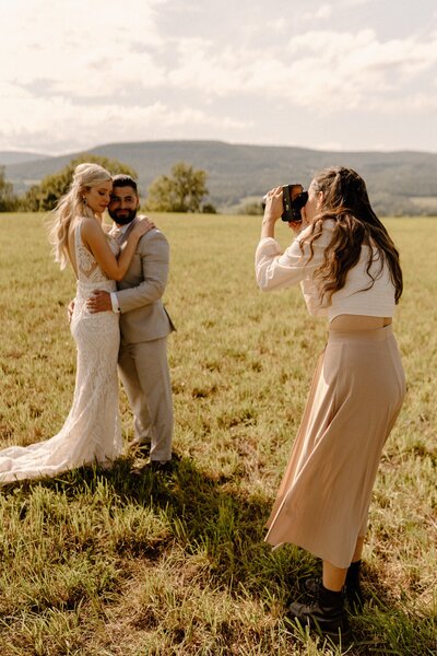 photographer taking photo of couple