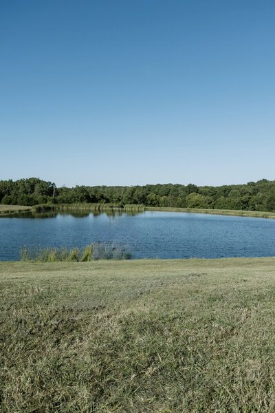 Outdoor pond ceremony site at Willstone Acres timeless venue