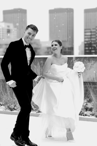 Joyful bride and groom dance their way out of their wedding