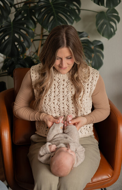 craniosacral therapist working with an infant on her lap