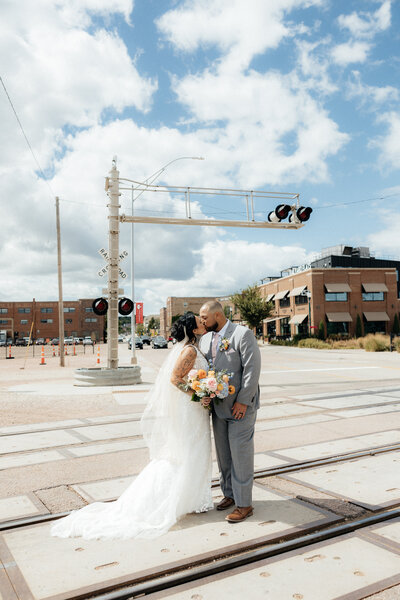 A bride smiling at her groom under the veil.
