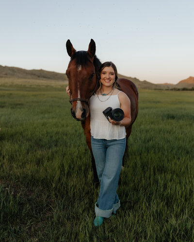 Self-portrait of a Wyoming-based wedding and lifestyle photographer, capturing a professional and artistic shot