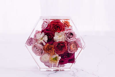 sunset color bouquet preserved in resin hexagon