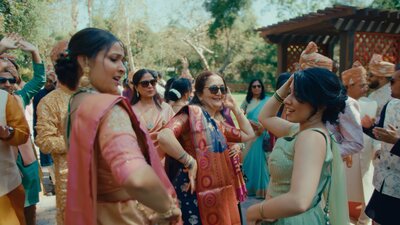 Indian wedding guests dancing