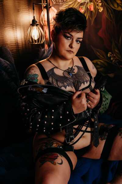 Boudoir photography woman in black lingerie wih short hair and tattoos in jean jacket in Amarillo TX