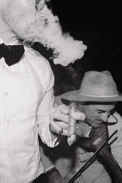 Wedding photographer captures couple taking a stroll hand in hand at their french chateau wedding.