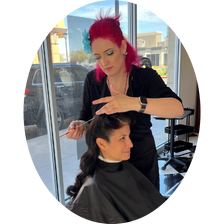Bridal hairstylist in Las Vegas styling a bride’s hair in a sunlit salon, capturing the quiet moments of preparation and connection before the big day.