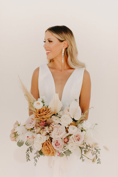 Bride Holding a Bouquet with Orchids - Breanna & Chris | Intimate Private Residence Kennewick Washington Wedding