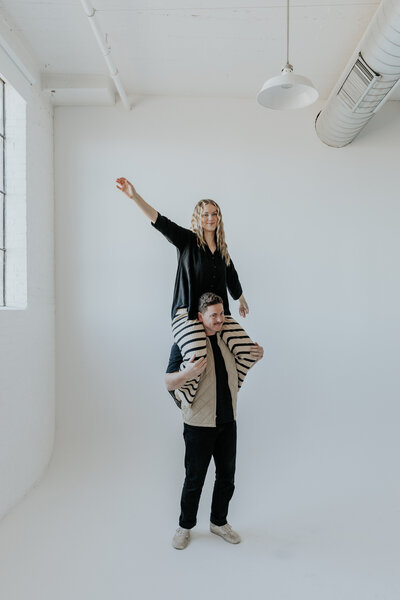 Bre sitting on clays shoulders