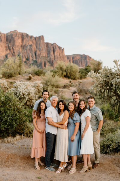 family of eight pose in arizona landscape