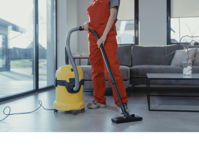 Person vacuuming modern living room in Yarmouth, NS home
