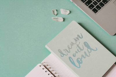Notebook cover that reads "Dream out loud"