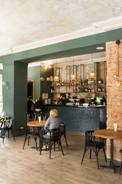 Petit Play Café staff assisting families during play sessions