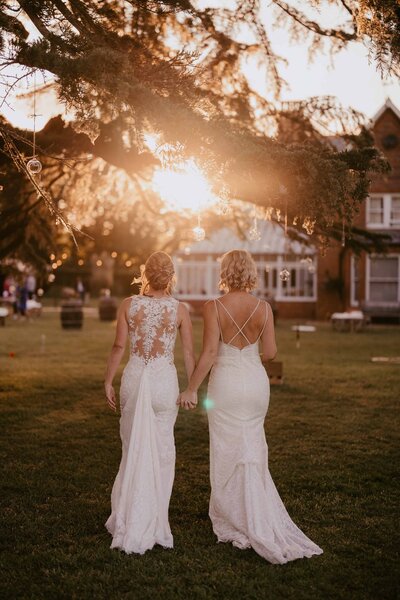 Two Brides walking into the sunset-1