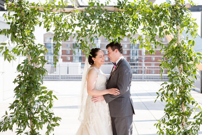 VisArts-Center-Rockville-MD-wedding-florist-Sweet-Blossoms-greenery-ceremony-arch-Paired-Images-Photography