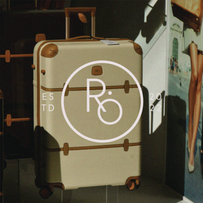 Rover Secondary Logo with brand photo of suitcase behind.