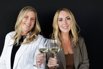 Real Estate Agents Toasting wine during content shoot in Portland, Oregon.