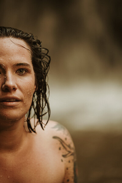 Event photographer takes photo of topless woman in water on Sunshine Coast