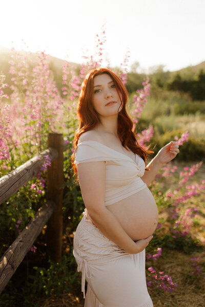 spring maternity photography with wildflowers
