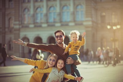 Family posing for a picture in Europe on vacation