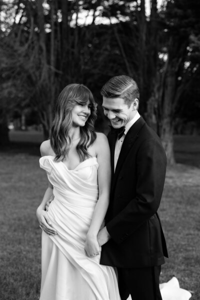 black and white image of bride with veil