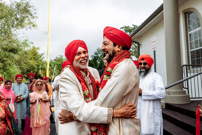 Hands exchanging a sacred ceremonial pot during an Indian wedding ritual, with intricate henna designs and colorful bangles visible. Captured by Shannon, an Orlando, Florida Indian Wedding Photographer.