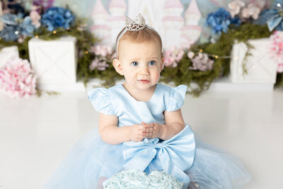 little girl in blue dress for cake smash in the lehigh valley