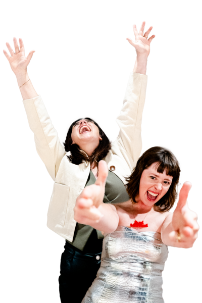 a wedding couples throwing their arms in the air because they just got married