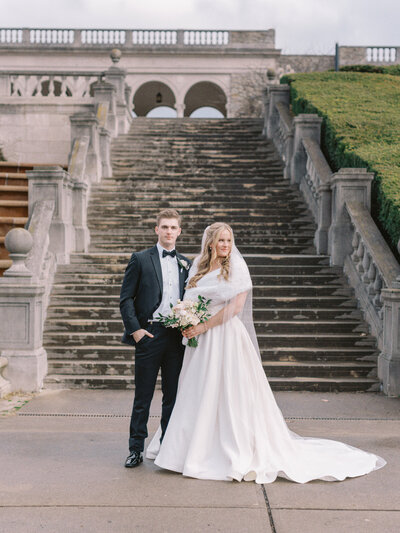 Bride and groom walk up memorial steps at their DC wedding