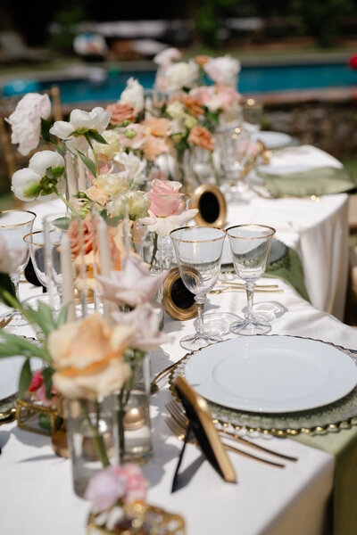 Luxury destination wedding villa reception set up in sage, gold and ivory