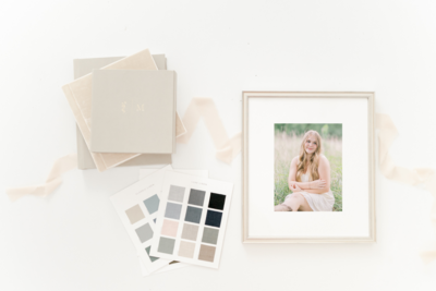 A framed senior photo surrounded by elegant frame corners on a white surface — Raleigh senior photographer, Lindsey Lambert Photography.