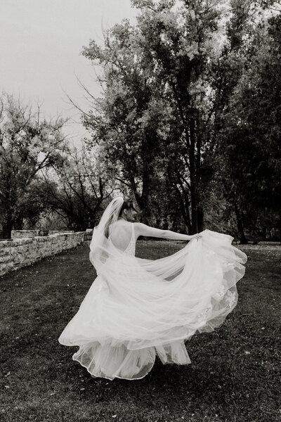 Bride twirling her wedding dress