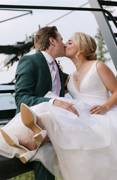 Bride and groom sharing a kiss during their Echo Mountain wedding day — Colorado mountain wedding photographer