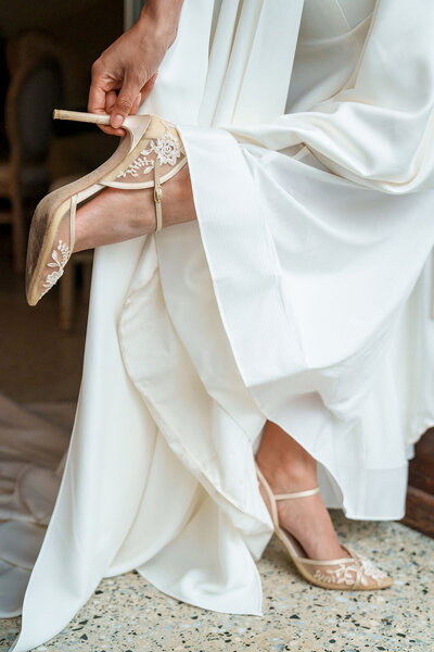bride putting on high heels