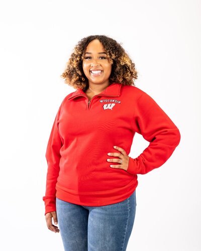 Model wearing Wisconsin Pullover Half Zip Sweatshirt in Red