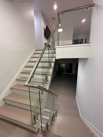 Top Quality Modern Glass Interior & Exterior Railings & Hand Rails. Rust Resistant & comes in silver, black, dark & light wood.