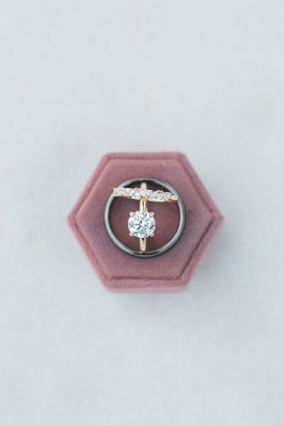 Three rings laying together in a ring box
