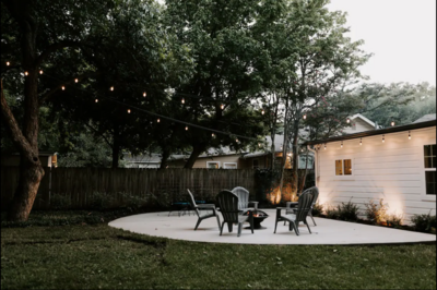 Private backyard with BBQ, firepit, and comfortable patio seating in this three-bedroom, two-bathroom farmhouse in Castle Heights, just a few miles from Magnolia, Baylor, and the McLane Stadium in downtown Waco, TX.