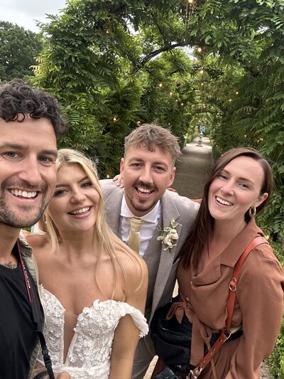 Amy & Nick posing with couple