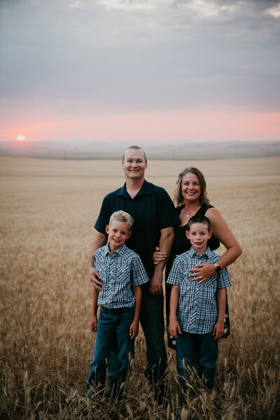 Family photography session in Circle, MT, featuring heartfelt moments surrounded by Montana’s serene countryside, ideal for families looking to preserve authentic memories in a natural, rustic environment.