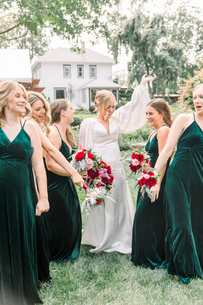 bride dancing with bridesmaid for photos